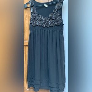 Black sleeveless dress with embroidered flowers